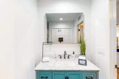 a bathroom with a sink and a mirror at Dog-Friendly Apt with Fenced Yard in Winter Park in Orlando