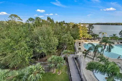 an aerial view of a resort with a pool and trees at 2BR condo minutes to Disney Springs in Orlando