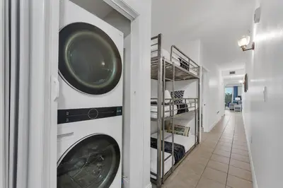a laundry room with two washer and dryer at 2BR condo minutes to Disney Springs in Orlando