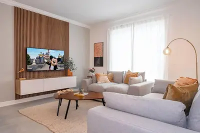 a living room with a couch and a tv at 2681 Stunning home perfect for your family in Kissimmee