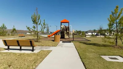 a park with a playground with a slide at 2681 Stunning home perfect for your family in Kissimmee