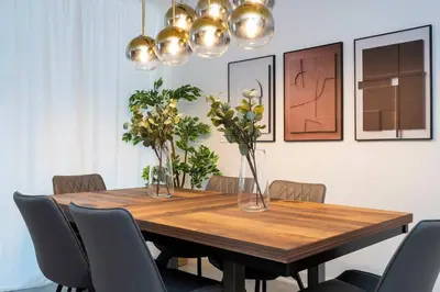 a dining room table with chairs and vases on it at 2681 Stunning home perfect for your family in Kissimmee