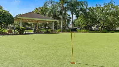a sign in the middle of a field of grass at 6BR Private Pool, Spa, Gameroom, Close to Disney in Orlando
