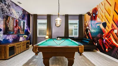 a living room with a pool table in it at Opulent Retreat, Pool & Lake View, Near Parks in Kissimmee