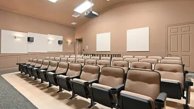 an empty lecture room with rows of chairs at Windsor Hills 7BR Villa Pool SPA Disney Greenview in Orlando