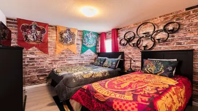 a bedroom with two beds and a brick wall at Windsor Hills 5br Private Pool, Near Disney in Orlando