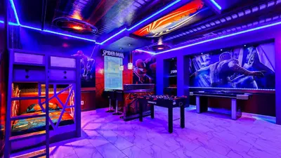 a room with ping pong tables and purple lights at Lakeview 10BR Home Pool/SPA Game Room Disney Theme in Kissimmee