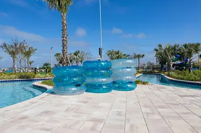a group of blue containers sitting next to a swimming pool at Star Wars Disney Themed 10BR Villa Pool/Spa/Game in Kissimmee