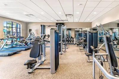 a gym with tread machines and treadles at Star Wars Disney Themed 10BR Villa Pool/Spa/Game in Kissimmee