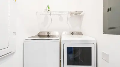 a kitchen with two microwaves sitting next to each other at Storey Lake 5br Family Townhome w Pool Near Disney in Kissimmee