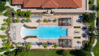 an overhead view of a pool at a resort at Game Room 12BR Kids World Pool Spa Near Disney in Kissimmee