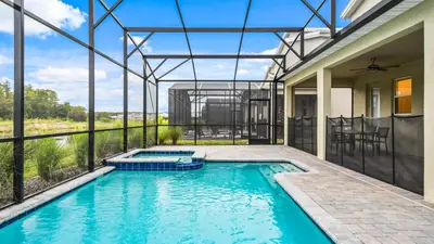 an indoor swimming pool in a house at Storey Lake 9BR Lakeview Home Pool/SPA/Game Disney in Kissimmee