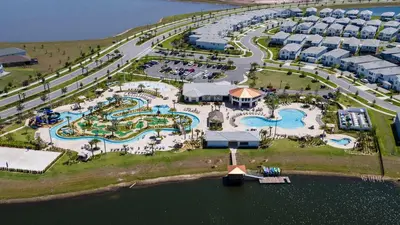 an aerial view of a resort with several pools at Themed Rooms & Pool in Storey Lake Resort in Kissimmee