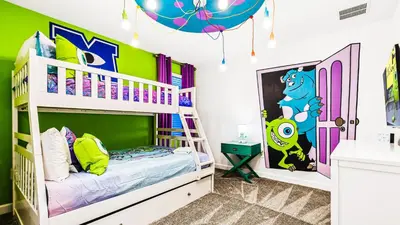 a childs bedroom with a bunk bed with a disney mural at Themed Rooms & Pool in Storey Lake Resort in Kissimmee