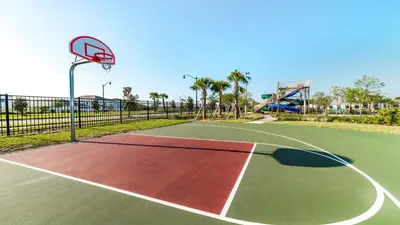 a basketball court with a hoop in a park at Cozy Home Storey Lake Resort Pool Spa Near Disney in Kissimmee
