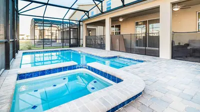 a swimming pool in the backyard of a house at Family Oasis: Pool, Themed Rooms & Resort Access in Kissimmee