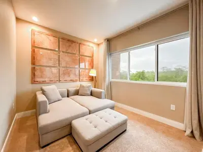 a living room with a white couch and a window at 3059 Luxury And Relaxation Just 1 Mile From Disney in Orlando