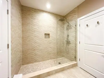 a bathroom with a shower with a glass door at 3059 Luxury And Relaxation Just 1 Mile From Disney in Orlando