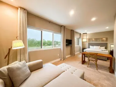a living room with a couch and a bed at 3059 Luxury And Relaxation Just 1 Mile From Disney in Orlando