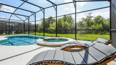 an igloo house with a swimming pool and a glass roof at Luxury Home: Pool, Theater, Near Disney in Kissimmee