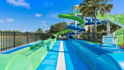 a water slide at a water park at Firework view 6BR Home Pool/Spa/Game Near Disney! in Orlando