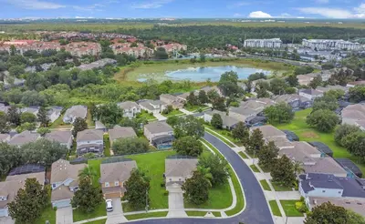 an aerial view of a residential neighborhood with a lake at Highland View 6BR Villa Private Pool Near Disney in Orlando