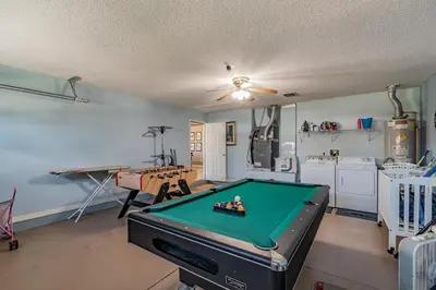 a living room with a pool table in it at Santee Villa in Kissimmee