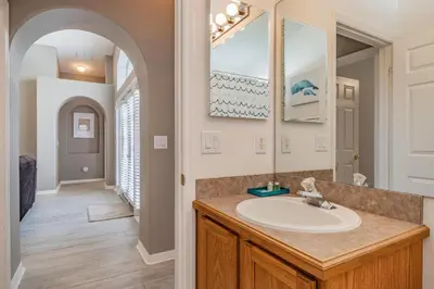 a bathroom with a sink and a mirror at Santee Villa in Kissimmee