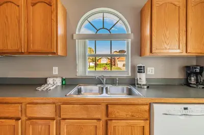 a kitchen with a sink and a window at Santee Villa in Kissimmee