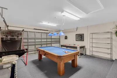 a room with a pool table in a room at 4 bedrooms pool home gated resort of Veranda Palms in Kissimmee
