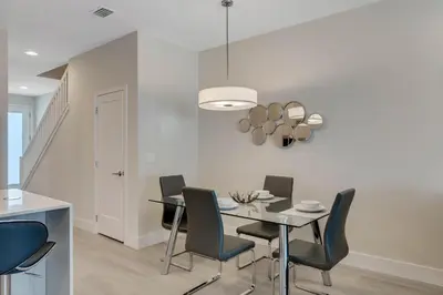 a dining room with a table and chairs at 3 bedrooms pool home Hidden Forest in Orlando