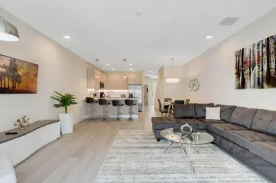 a living room with a couch and a table at 3 bedrooms pool home Hidden Forest in Orlando