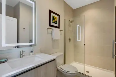 a bathroom with a sink and a toilet and a shower at 3 bedrooms pool home Hidden Forest in Orlando
