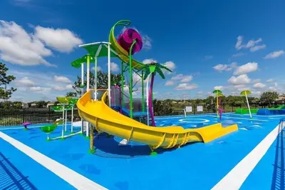 a playground with a slide in a swimming pool at WH7642SKC 3 beds pool home Gated resort in Orlando