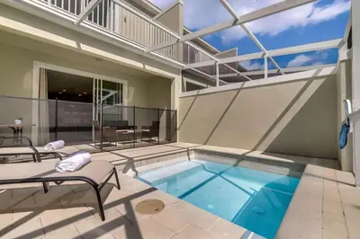 a swimming pool in a house with a patio at 3 bedrooms pool home with clubhouse amenities Retreat in Orlando