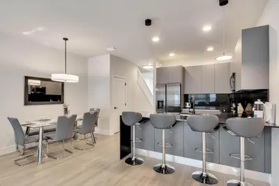 a kitchen and dining room with a table and chairs at 3 bedrooms pool home Hidden Forest Resort Amenities in Orlando