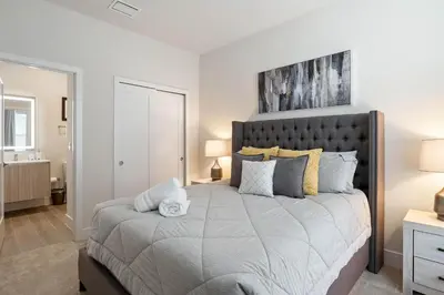 a bedroom with a large bed in a room at 3 bedrooms pool home Hidden Forest Resort Amenities in Orlando