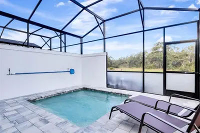 a large indoor pool with a glass ceiling at 4 bedrooms pool home Hidden Forest Resort Amenities in Orlando