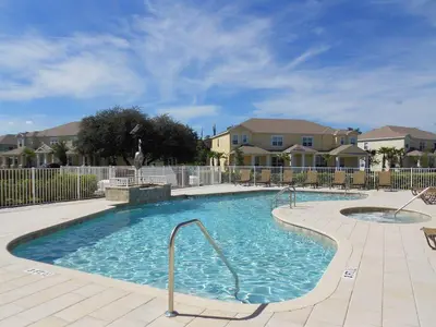 a large swimming pool in a yard with houses at 3 bedrooms pool home Hidden Forest Resort Amenities in Orlando