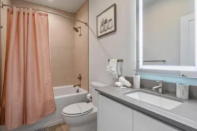 a bathroom with a toilet and a sink and a shower at 3 bedrooms pool home Hidden Forest Resort Amenities in Orlando