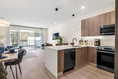 a kitchen and living room with a table and chairs at TR17126 - 3 Bed-3 bath w/pool near Disney sleeps 6 in Orlando