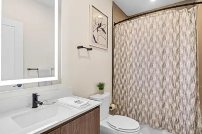 a bathroom with a toilet and a shower curtain at TR17126 - 3 Bed-3 bath w/pool near Disney sleeps 6 in Orlando