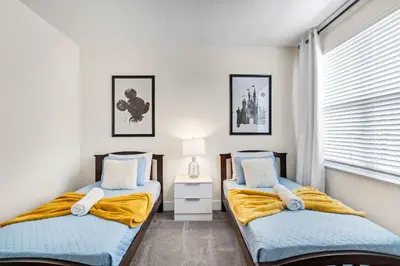 a bedroom with two beds and a window at TR17126 - 3 Bed-3 bath w/pool near Disney sleeps 6 in Orlando