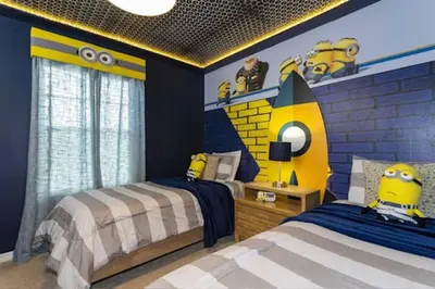 a bedroom with two beds and a minion wall at Amazing Unbeatable Experience Themed Home w/ Private Pool and Resort in Kissimmee