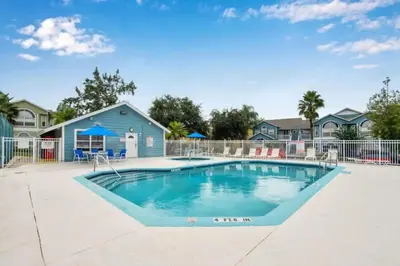 a swimming pool in the courtyard of a home at Villa at Island Club in Kissimmee