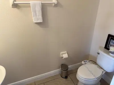a bathroom with a toilet and a sink at 6 bedrooms pool home Encore Reunion Resort Gated in Orlando