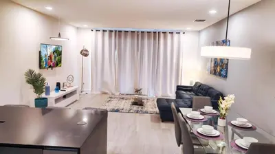 a living room with a table and a dining room at 3 bedrooms pool home Hidden Forest Resort Amenities in Orlando