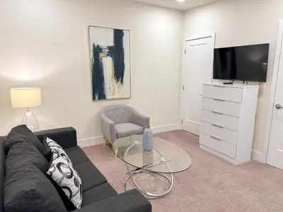 a living room with a couch and a tv at 3 bedrooms pool home Hidden Forest Resort Amenities in Orlando