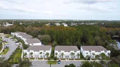 an aerial view of a residential neighborhood with houses at 3 bedrooms pool home Hidden Forest Resort Amenities in Orlando
