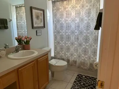 a bathroom with a toilet and a sink and a shower at S890SB - 12 guests - 6 beds in Kissimmee